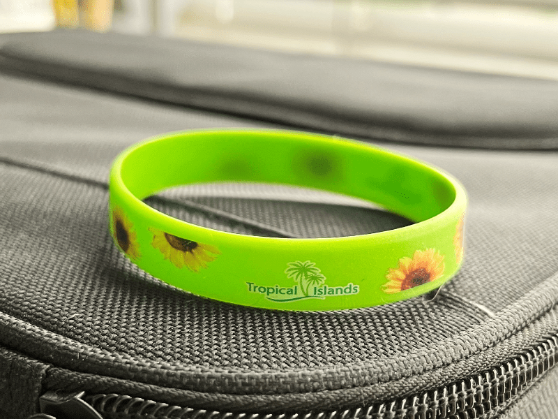 Services for disabled - service area at Tropical Islands: We offer a sunflower wristband for those with invisible disabilities, available free with a disabled pass at the information desk. This wristband helps communicate the need for extra assistance, understanding, or time during your visit